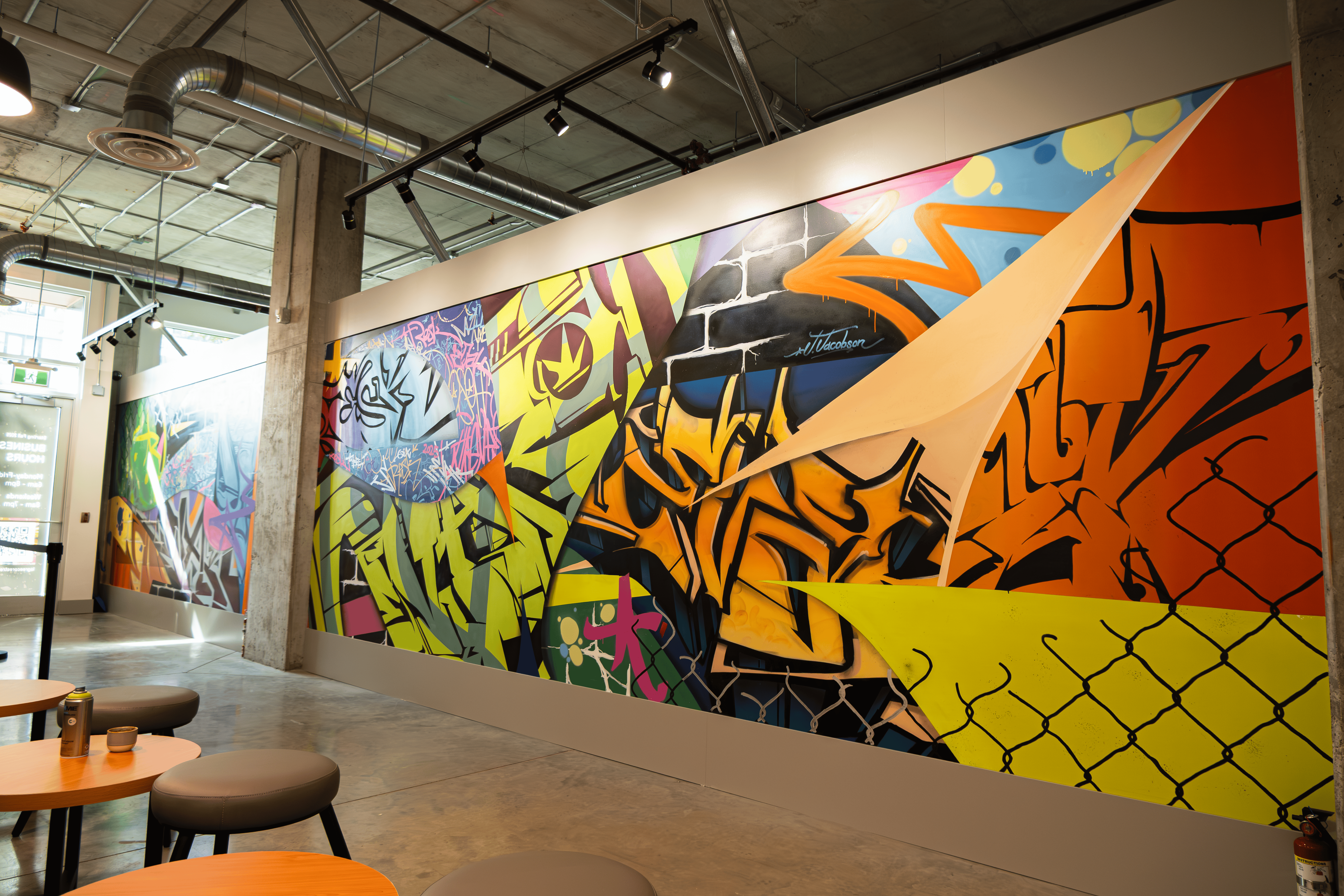 The visual anchor: The hand-painted mural, completed in the physical space, standing as a landmark in its own right.