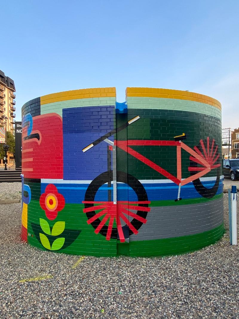 Detail of abstract figures and geometric shapes representing daily life in the Broadway district.