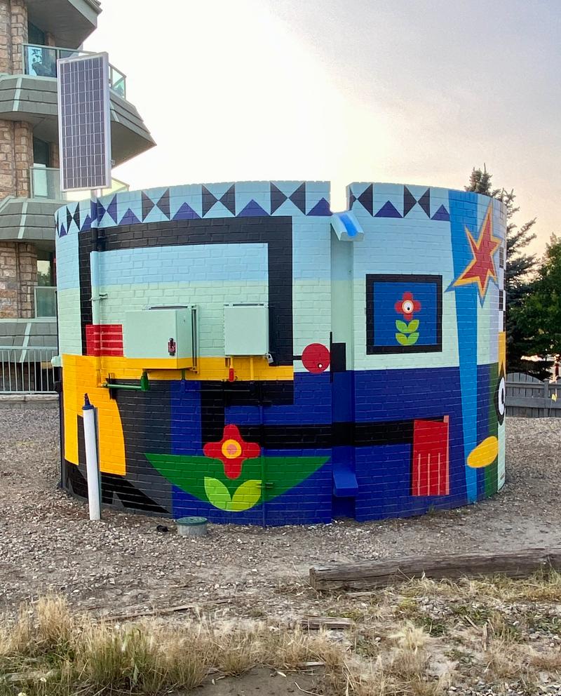 Close-up of bold color interactions and minimalist forms within the mural.