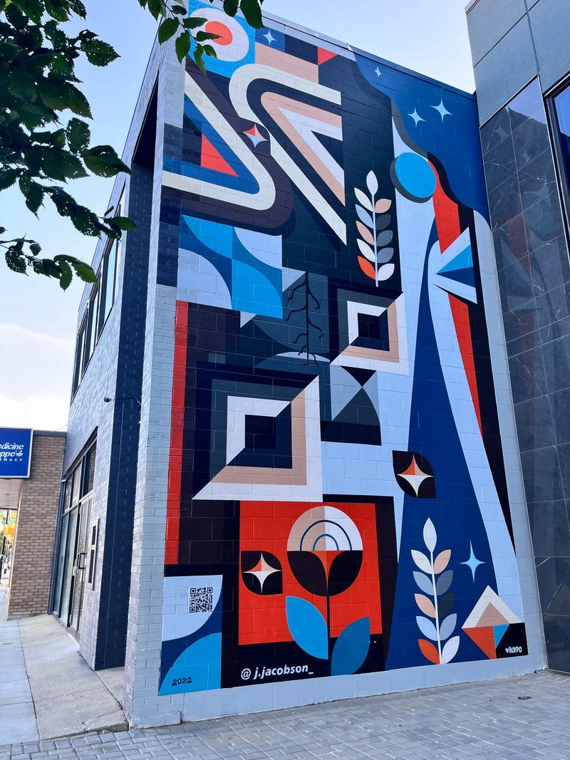 Detail showing geometric forms and plant-inspired elements.