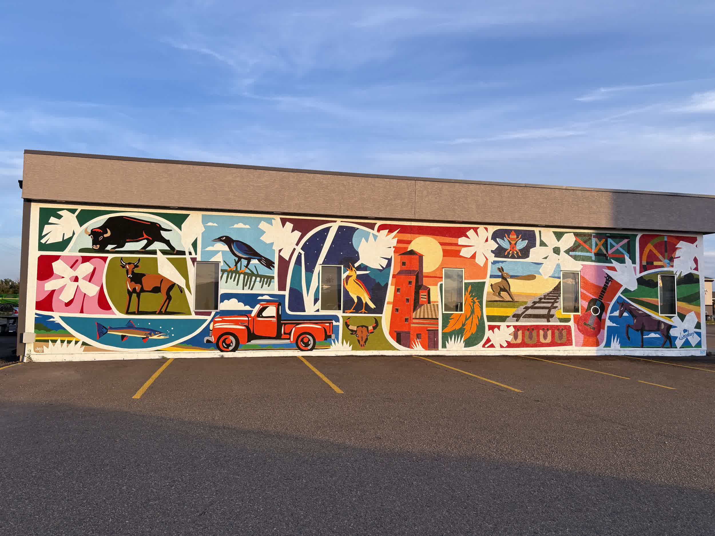 Detail view showing layered geometric shapes and prairie wildlife.